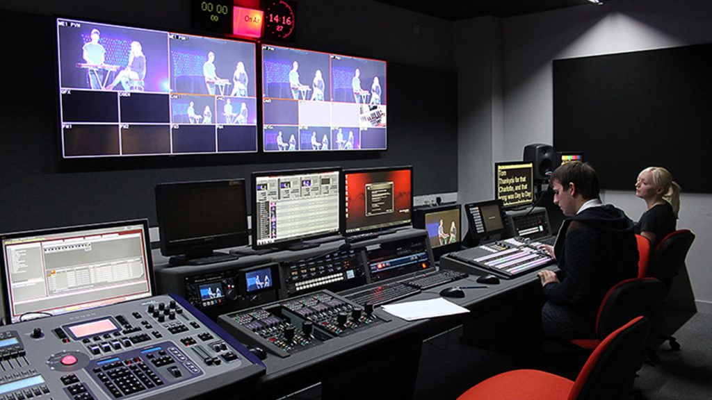 Two students working in the Creative Edge studio on campus