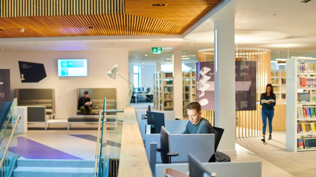 Three students studying in Catalyst.