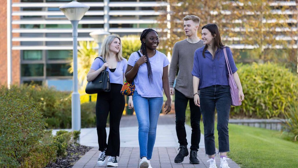 A group of students walking across campus.